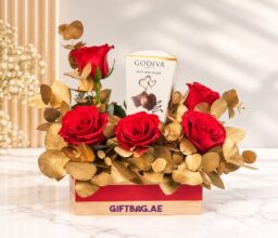 Godiva Masterpieces with Red & Gold Floral Arrangement
